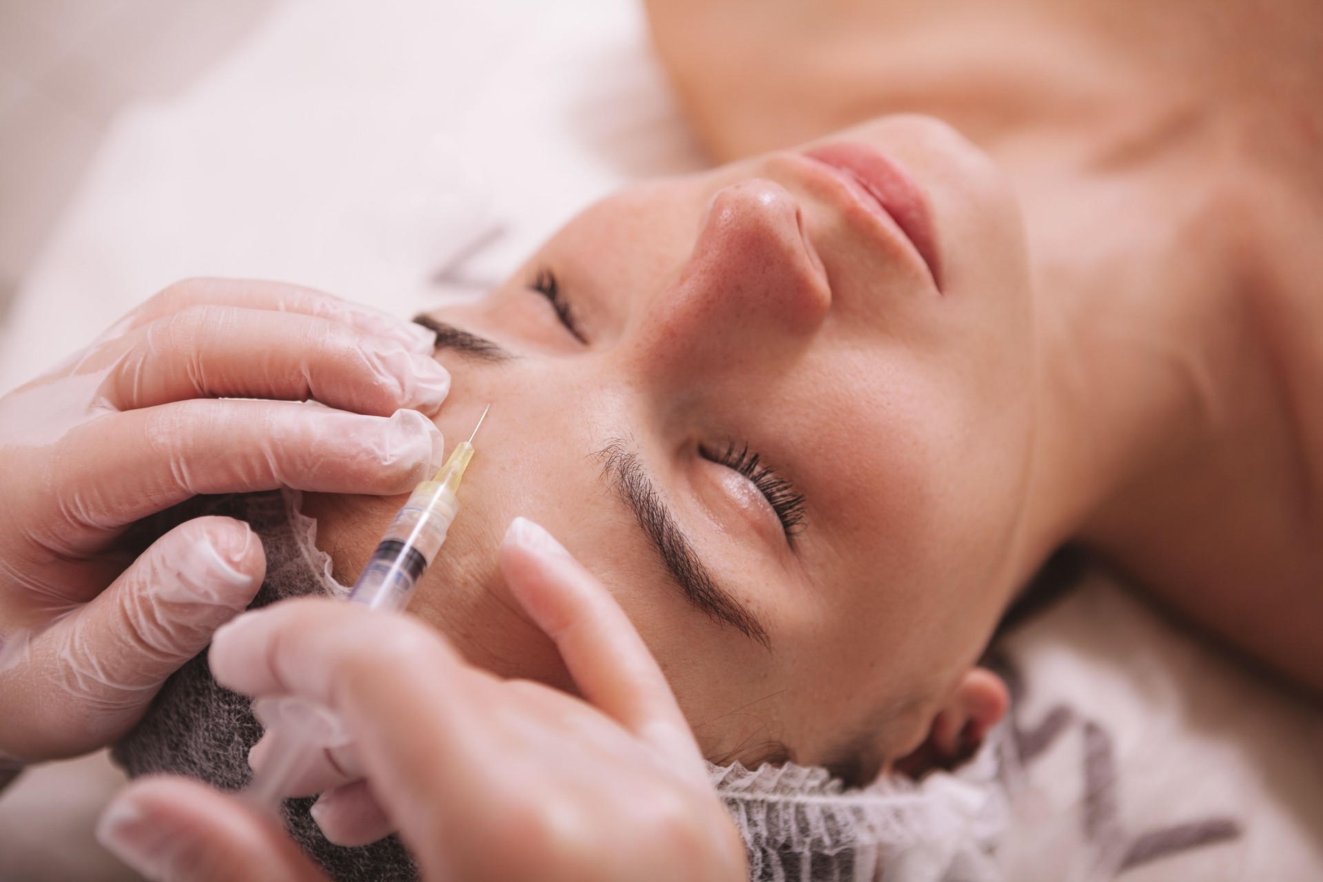 Beautiful young woman at cosmetology clinic